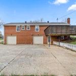 DW Properties - 1283 Hillwood Drive - Property for Rent - view of rear driveway, deck, 2 garages and walkout basement